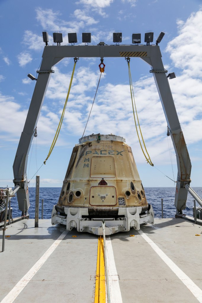 SpaceX CRS-20 Dragon spacecraft after splashdown in the Pacific Ocean.
